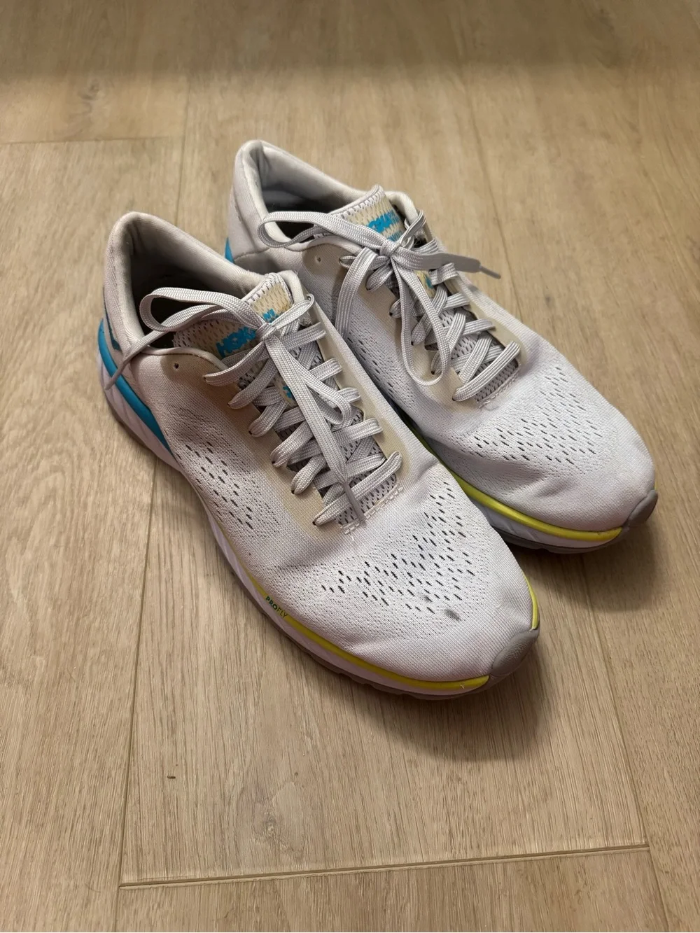 Hoka Women's Grey Running Shoes with Blue and Yellow Accents